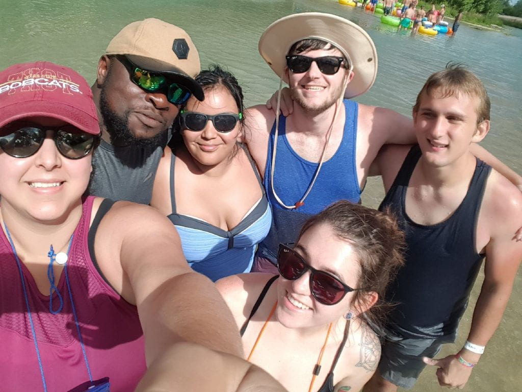 Group members having fun tubing the San Marcos River Summer 2018