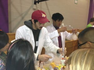 students performing chemistry demonstrations
